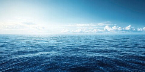 Wall Mural - Vast ocean surface with gentle waves under a clear blue sky.