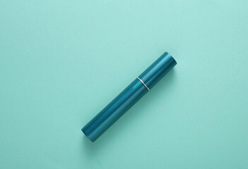 Tube of mascara on a blue background