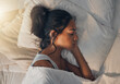 © CourtH/peopleimages.com - Woman, tired and sleeping in morning for rest, comfort and exhausted in home with blanket and pillow. Female person, fatigue and asleep in bed for nap, dream and burnout with relax, peace and break