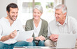 © CineLens2024/peopleimages.com - Financial advisor, laptop and old couple with documents, home and retirement fund in lounge. Consultant, senior man and elderly woman with pc, paperwork and planning for future, budget and mortgage