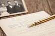 © good everyday - A vintage pen rests on a document with a photo of a couple in the background.