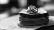 © Pannin - Wedding rings on a stack of divorce paperwork, symbolizing the finality of a relationship ending legally and emotionally