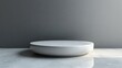 © Alienmarsh - A minimalist white plate on a textured surface with soft lighting.