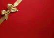 © Alexandra - Golden ribbon is forming a bow on a red background for a christmas gift