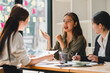 © kenchiro168 - Engaged women discussing ideas in modern office setting, showcasing collaboration and creativity. Their expressions reflect enthusiasm and teamwork