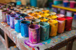 © ArtShop - Table with many paint jars of different colors