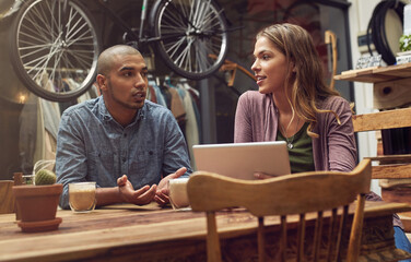 Leinwandbilder - Small business, people and tablet at bicycle shop with coffee for online orders, ecommerce or calendar. Partners, employees and serious at apparel store on website or internet for social media review