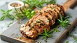 © Palette_Dreams - Sliced portion of marinated and grilled pork tenderloin on a wooden board
