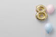 © iamfrk7 - Gold number 8 foil balloon with pastel blue and pink balloons for eighth birthday celebration, event decoration, or festive party design with a minimal and elegant aesthetic