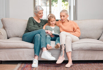 Poster - House, grandmama and girl with tablet, mother and typing with smile, happiness and relax in living room. Family, granny and daughter with tech, mom and bonding together with digital app in lounge