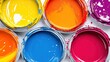 © Anna - Brightly colored paint cans are strategically placed, displaying a variety of vivid hues, perfect for inspiring creativity in any artistic project or DIY workspace