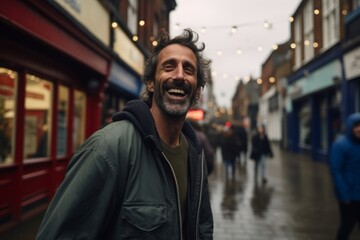 Sticker - Portrait of a handsome man laughing while walking in the street.