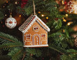© Monica - gingerbread house ornament on a Christmas tree AI