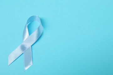 Canvas Print - Light blue ribbon on color background, top view with space for text. Prostate cancer awareness