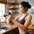 © Bethany - beautiful woman using fitness device exercising in kitchen. beautiful woman training holding flexing equipment follow home fitness trend. gorgeous asian woman workout in kitchen using tool for muscle