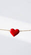 © Rysak - red heart hanging from a gold cord