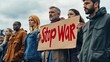 © Matthew - A group of protesters holding a sign that says 'Stop War' during a demonstration against conflict.