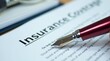 © vitanovski - Insurance coverage document with fountain pen and glasses on desk