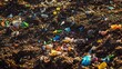 © wikkie - A close-up of soil mixed with colorful plastic debris, highlighting pollution issues.