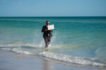 Wall Mural - Excited businessman in wet suit run in sea. Funny business man, crazy comic business concept. Remote online working. Crazy summer business. Fun business lifestyle. Funny freelance businessman.