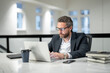 © Volodymyr - Business man entrepreneur startup owner in modern office. Occupation person in work space. Business portrait. Confident business worker. Business, finance and employment. Successful office worker.