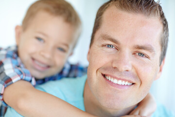 Piggyback, father, and son with portrait at house of safety, bonding together and love of relationship. Happy, man and child for calm morning, weekend break and family support of embrace at apartment