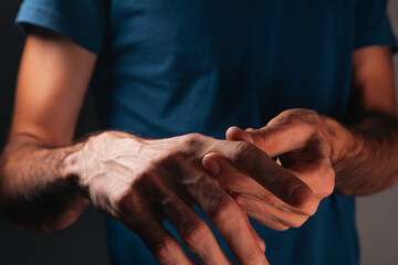 Wall Mural - close up of male patient hand with pain in the hospital.