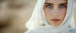 © k_viktar - Portrait of woman with blue eyes, white headscarf, soft focus background