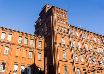 industrial architectural background, vintage factory building against a sky