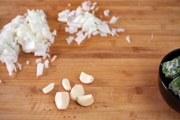 man in the kitchen peeling onions