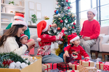 A man and a woman celebrate Christmas with their family.