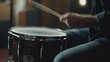 © Suphawan - A close-up of a snare drum being played in a studio, with the musician's hands moving quickly, creating a blurred effect on the drumsticks. --chaos