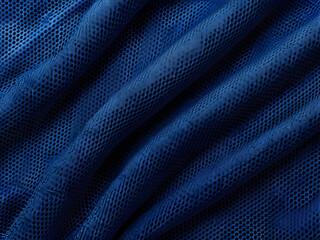 A close-up photo of a bright blue fabric with subtle textures, showing a mesh shell