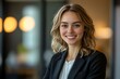© Imagentive - Confident Female Executive Smiling in Black Blazer Headshot