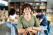 © Xavier Lorenzo - Young high school student man smiling at camera at library. Education and youth concept.