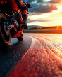 © Narongsak - A stunning motorcycle leans into a curve on a wet racetrack, capturing the thrill of speed and maneuverability against a dramatic sunset backdrop.