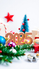 Canvas Print - golden 2025 number surrounded by festive christmas decorations