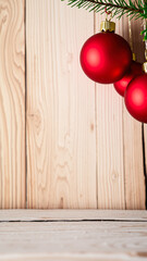 Wall Mural - three red ornaments hanging from a pine branch