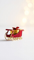 Sticker - miniature red sleigh with gold accents carries wrapped gifts