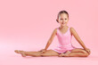 © New Africa - Portrait of little ballerina on pink background
