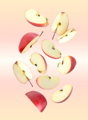 Canvas Print - Sliced red apples in air on beige gradient background