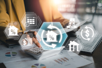 Business professional using technology to explore refinancing options with financial icons overlayed, symbolizing modern finance solutions.