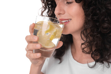 Canvas Print - Woman drinking water with lemon on white background, closeup