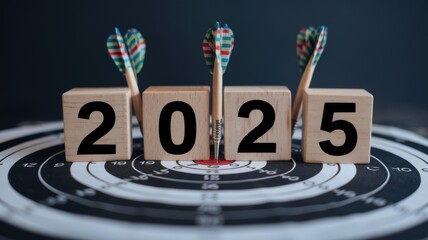 Wooden blocks displaying 2025 on a dartboard symbolizing goal setting and achievement for the upcoming year.