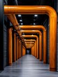 © Chananporn - Industrial hallway featuring orange pipes on grey floor, modern architecture