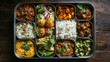© Theeranan - An overhead view of a traditional Indian lunchbox packed with an array of colorful, aromatic dishes that represent the richness of Indian cuisine.