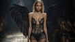 © Julia Zarubina - top model in luxurious lingerie with black wings on the catwalk, fashion show