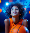 © ChaoticDesignStudio - A young athlete smiles brightly while holding a basketball during a lively indoor practice session
