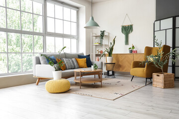 Sticker - Interior of stylish living room with armchair, sofa and plants