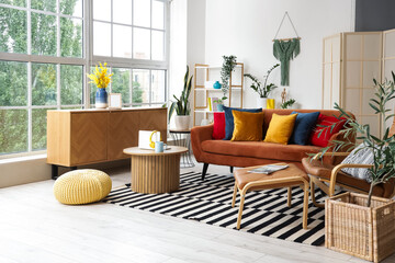 Sticker - Interior of stylish living room with red sofa, table and armchair